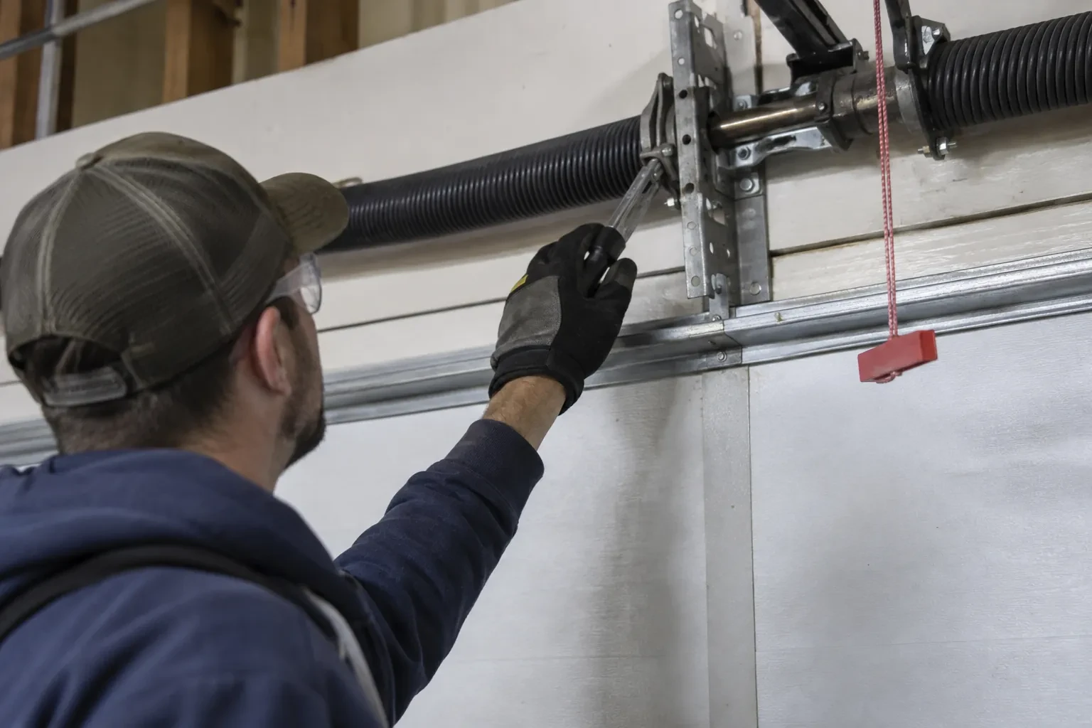 Illustrative garage doors scene; not an actual job